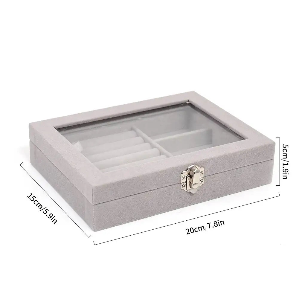 Gray jewelry box with glass top and dimensions on a white background