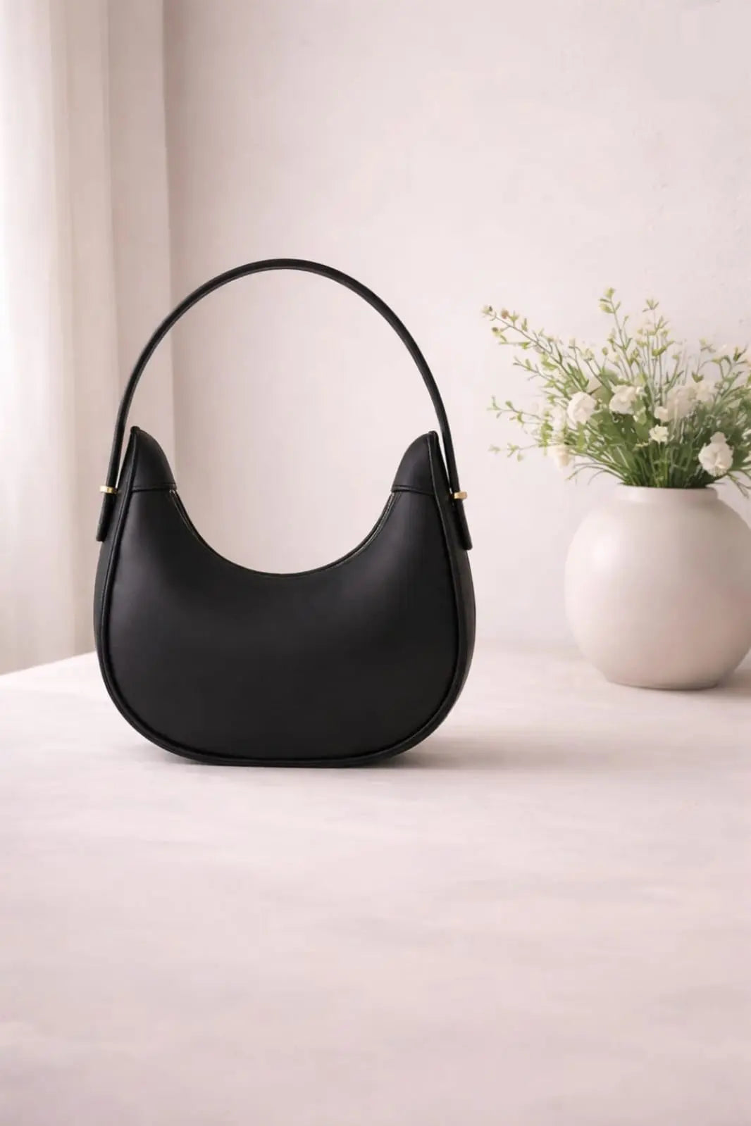 Elegant half moon minimalist shoulder bag for women in Pakistan.