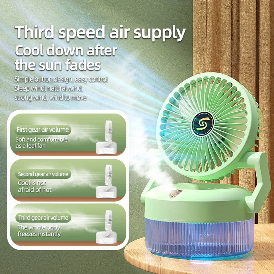 Green portable fan with speed control options on a wooden surface.