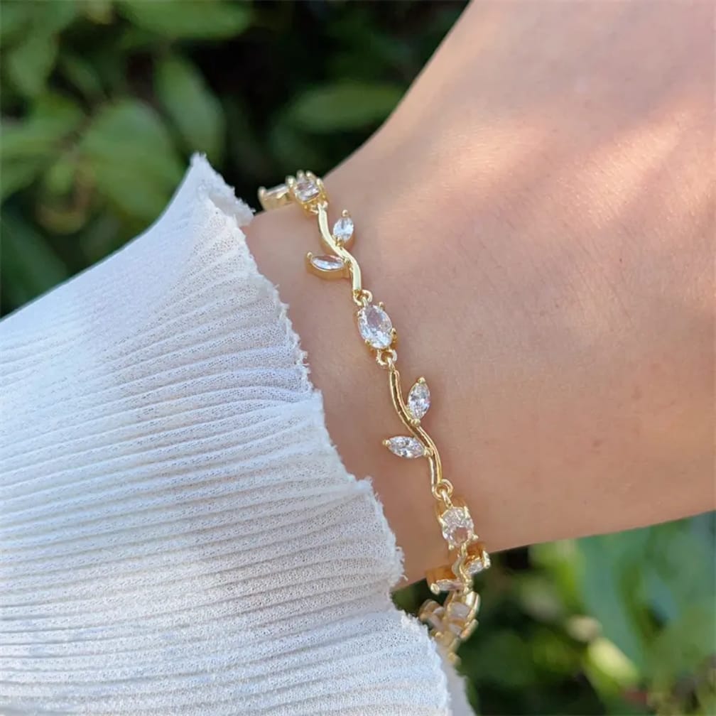 Close-up of a woman's hand wearing a premium stainless steel green Tulip Bracelet