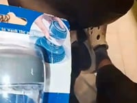 Top view of the squeeze button mechanism on the automatic liquid cleaning brush
