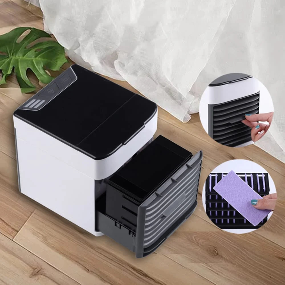 Maintenance view of a personal air cooler showing a slide-out washable evaporative filter and adjustable vertical airflow vents for improved cooling control and easy cleaning.